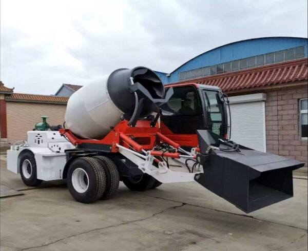 Mobile self loading concrete mixer